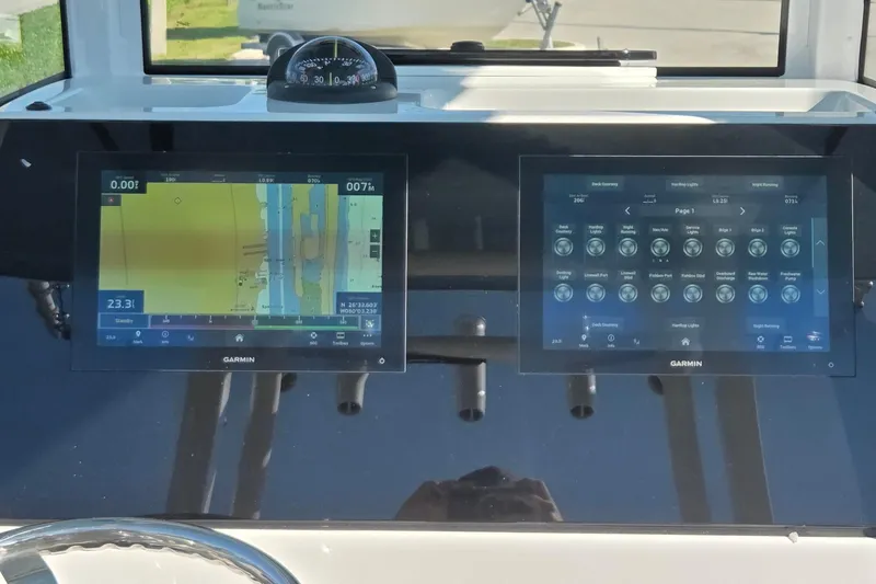 Slide: The Image of 2022 Sportsman Open 282TE Center Console with dual Garmin displays and compass. - 25