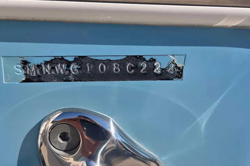 Slide: The Image of 2022 Sportsman Open 282TE Center Console hull identification number on blue surface. - 26