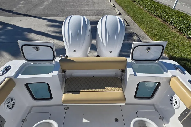 Slide: The Image of 2022 Sportsman Open 282TE Center Console boat with dual engines and seating area. - 9