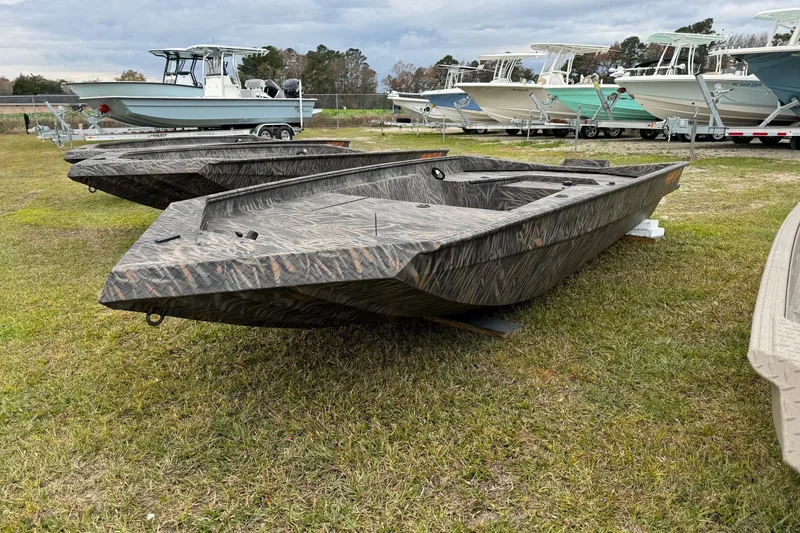 Slide: The Image of 2026 Alweld 1548VV Marsh boat interior with four-stroke engine and open storage compartment. - 4