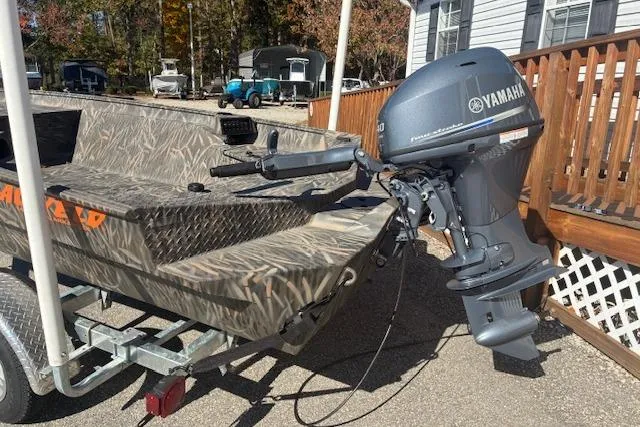 The Image of 2025 G3 1652 CC boat on trailer at Angler's Marine NC, Yamaha sales sign visible. - 1