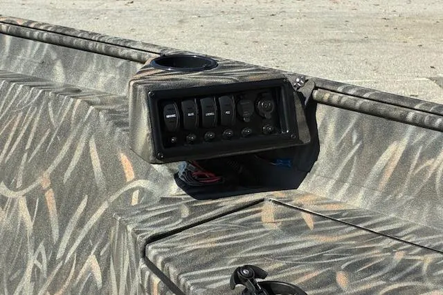 Slide: The Image of 2025 G3 1652 CC boat with Yamaha outboard motor in a parking lot. - 3