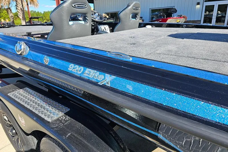Slide: The Image of 2026 Phoenix 920 Elite X boat with sleek blue finish and modern design. - 10