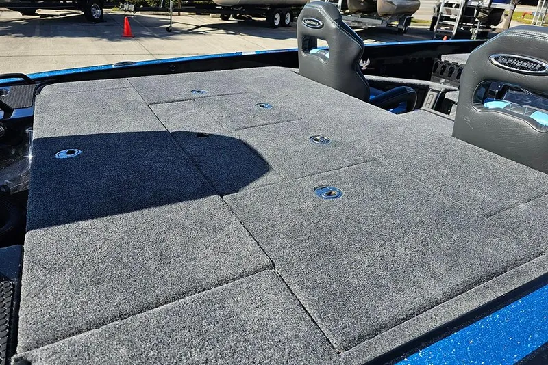 Slide: The Image of 2026 Phoenix 920 Elite X boat deck with gray carpet and seating. - 12