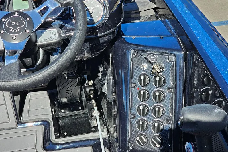 Slide: The Image of Steering wheel and control panel of 2026 Phoenix 920 Elite X boat. - 17