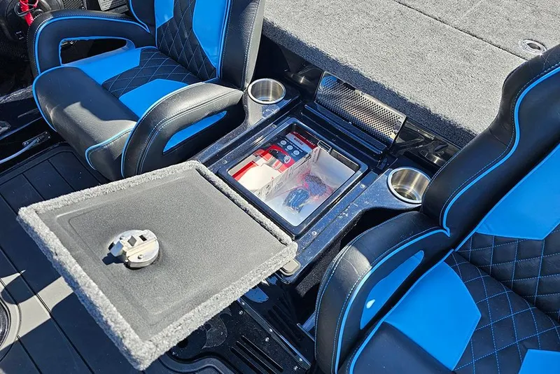 Slide: The Image of Interior of 2026 Phoenix 920 Elite X with blue and black seats, storage compartment. - 19