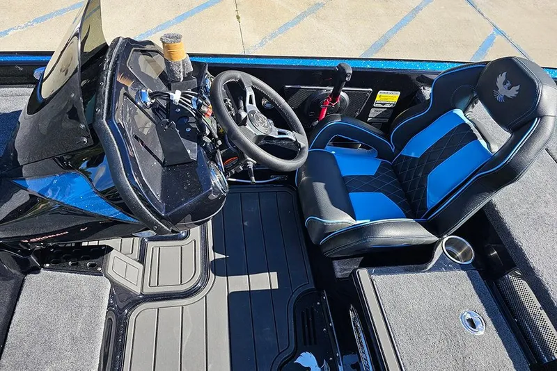 Slide: The Image of Interior of 2026 Phoenix 920 Elite X boat with black and blue seating. - 21