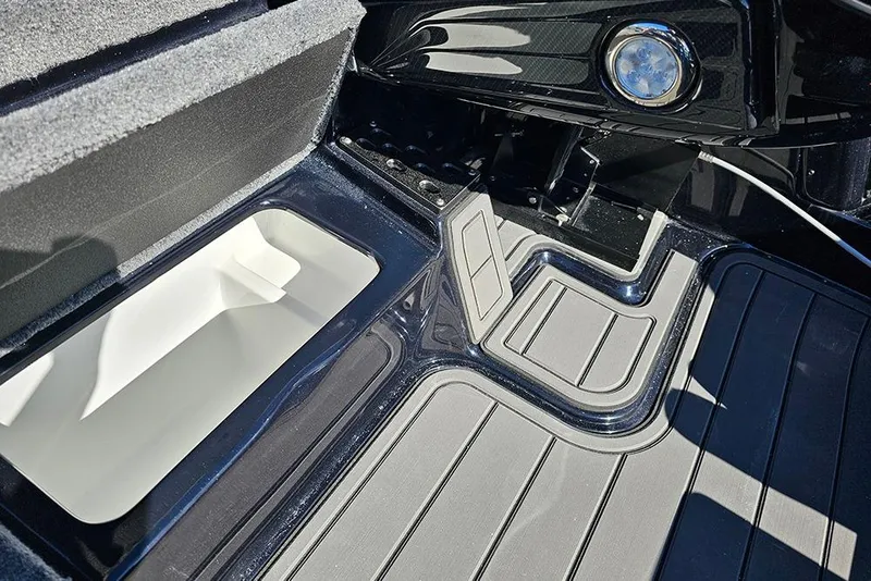 Slide: The Image of Interior view of 2026 Phoenix 920 Elite X boat, featuring storage compartment and sleek design. - 22