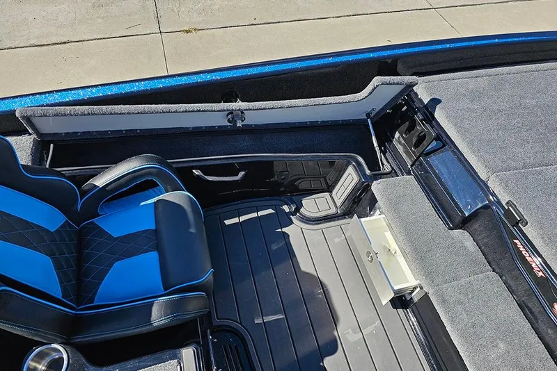 Slide: The Image of Interior of 2026 Phoenix 920 Elite X boat with blue and black seating. - 23