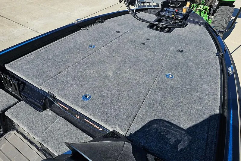 Slide: The Image of 2026 Phoenix 920 Elite X boat deck with carpeted surface and storage compartments. - 24