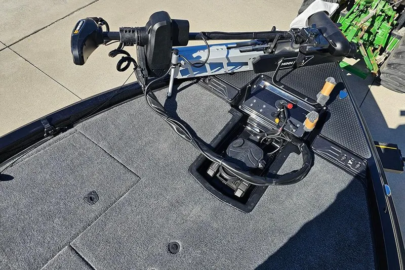 Slide: The Image of 2026 Phoenix 920 Elite X boat deck with advanced control panel and trolling motor. - 26