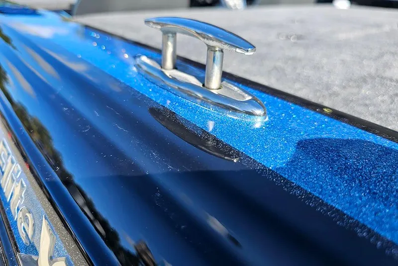 Slide: The Image of Close-up of 2026 Phoenix 920 Elite X boat cleat on a shiny blue surface. - 31