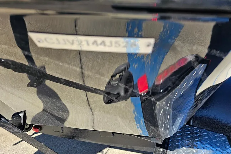 Slide: The Image of Reflection on Phoenix 920 Elite X 2026 boat hull with visible serial number. - 32