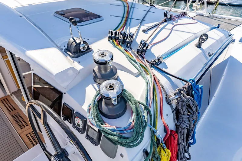 Slide: The Image of Cockpit of 2014 Outremer 51 sailboat with colorful ropes and winches. - 11