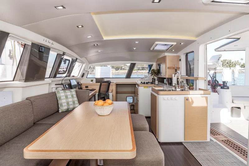 Slide: The Image of Luxurious interior of 2014 Outremer 51 catamaran with modern kitchen and dining area. - 17