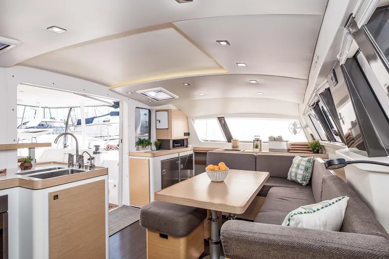Slide: The Image of Luxurious interior of 2014 Outremer 51 catamaran with modern kitchen and cozy seating area. - 18