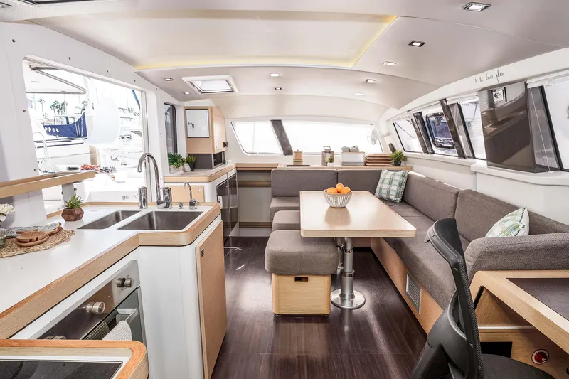 Slide: The Image of Luxurious interior of 2014 Outremer 51 catamaran with modern kitchen and cozy seating area. - 19