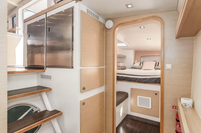 Slide: The Image of Interior of 2014 Outremer 51 yacht featuring modern cabin and stainless steel accents. - 24