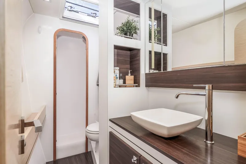 Slide: The Image of Luxurious bathroom interior of 2014 Outremer 51 yacht with modern sink and wooden accents. - 27