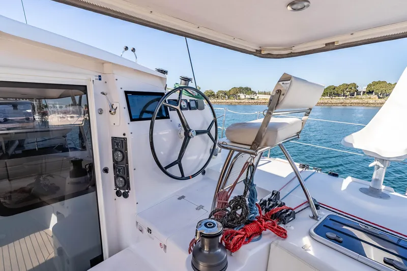 Slide: The Image of Helm station of 2014 Outremer 51 catamaran with steering wheel and seating. - 8
