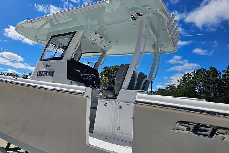 Slide: The Image of 2026 Sea Pro 322 Offshore boat with sleek design under clear blue sky. - 12