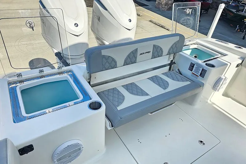 Slide: The Image of 2026 Sea Pro 322 Offshore boat interior with seating and storage compartments. - 14