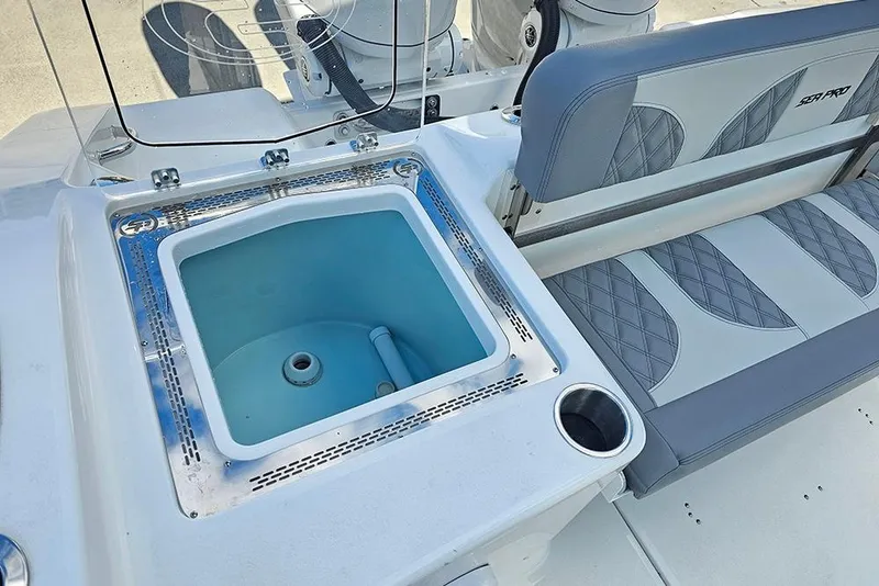 Slide: The Image of 2026 Sea Pro 322 Offshore boat interior with seating and built-in livewell. - 15