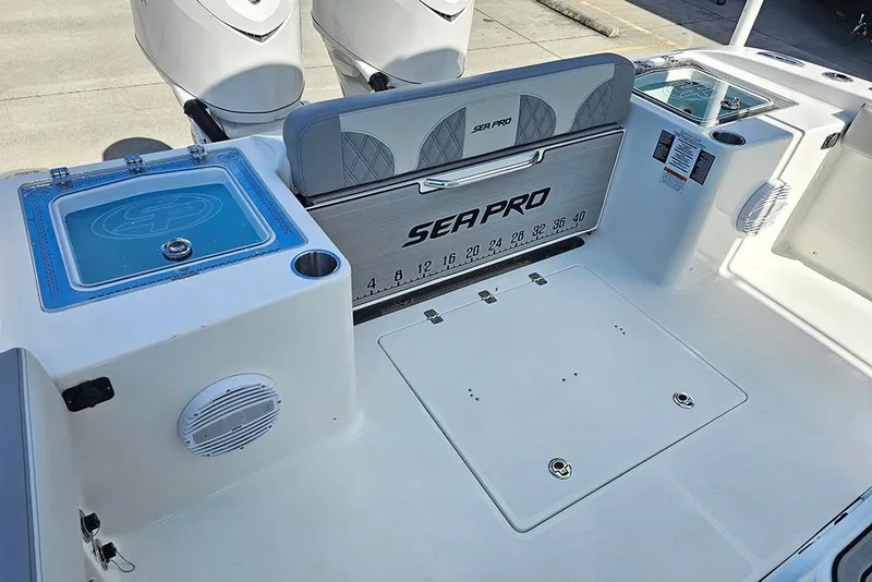 Slide: The Image of 2026 Sea Pro 322 Offshore boat deck with storage and seating features. - 16