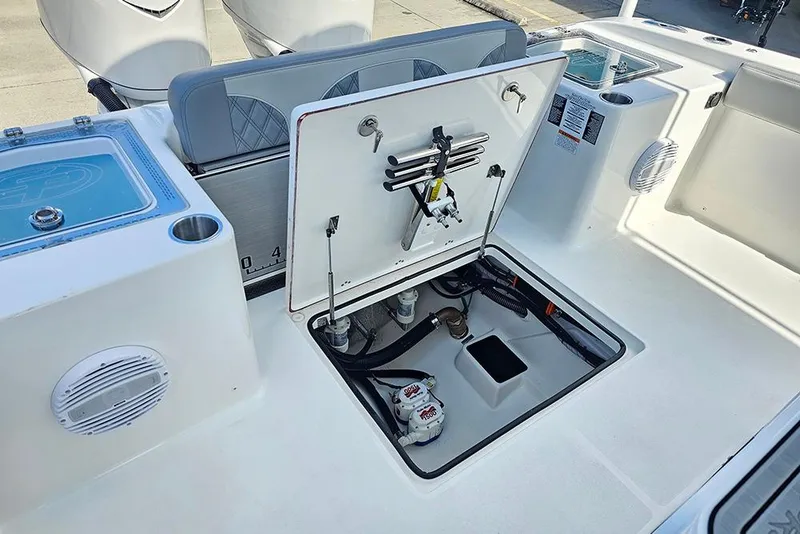 Slide: The Image of 2026 Sea Pro 322 Offshore boat deck with open hatch and storage compartments. - 17