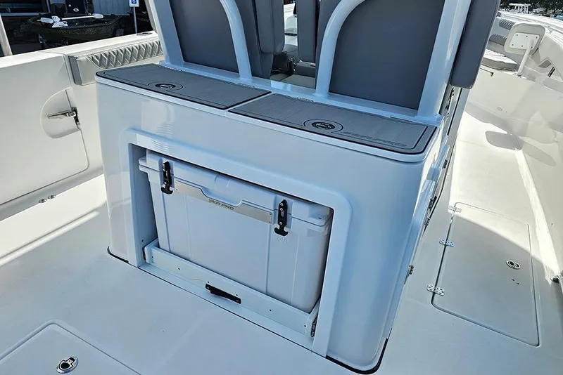 Slide: The Image of 2026 Sea Pro 322 Offshore boat interior with storage compartment and seating. - 18