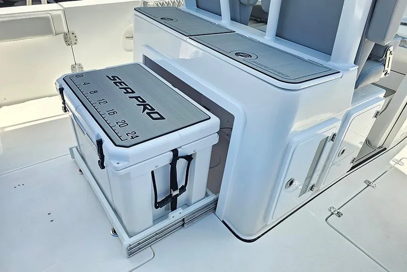 Slide: The Image of 2026 Sea Pro 322 Offshore boat interior with integrated cooler and seating. - 19