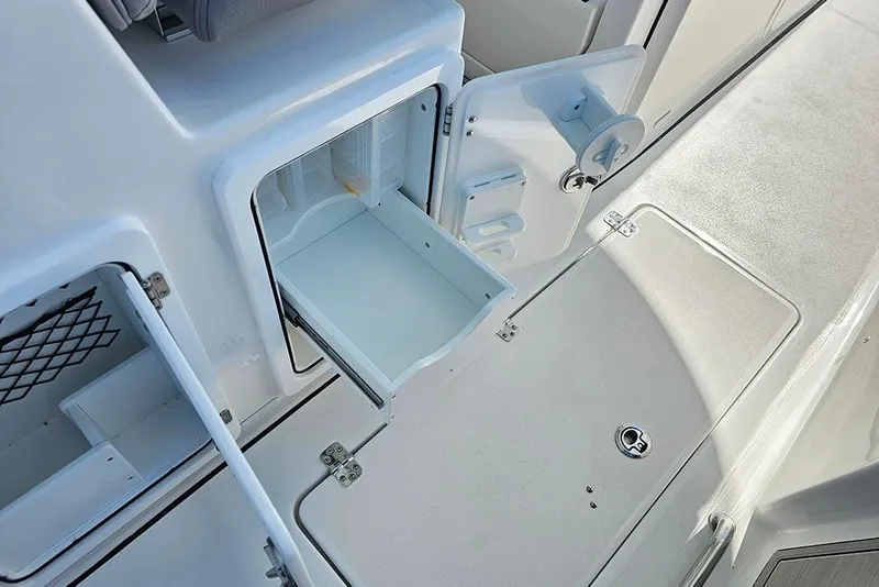 Slide: The Image of 2026 Sea Pro 322 Offshore boat interior with open storage compartment. - 23