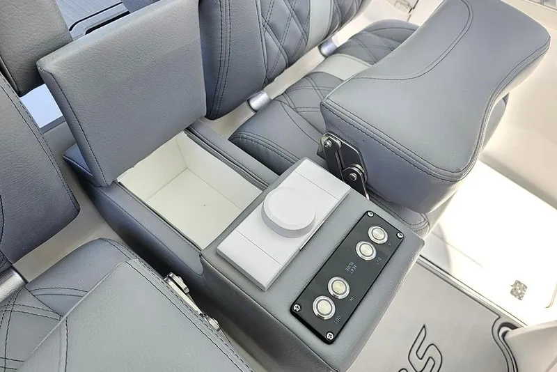 Slide: The Image of 2026 Sea Pro 322 Offshore boat interior with gray seating and control panel. - 26