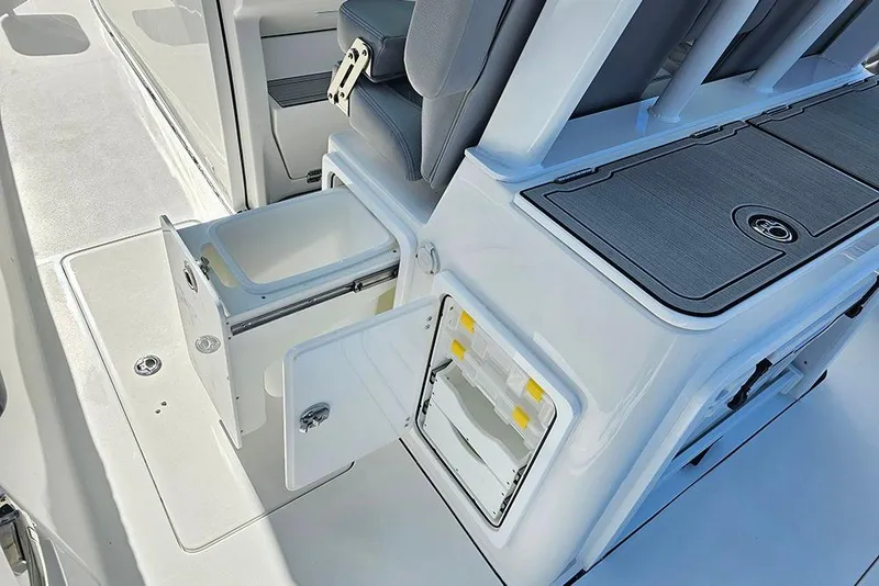 Slide: The Image of 2026 Sea Pro 322 Offshore boat interior with storage compartments and seating. - 27