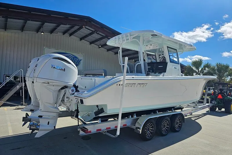 Slide: The Image of 2026 Sea Pro 322 Offshore boat on trailer, featuring dual Yamaha engines. - 3
