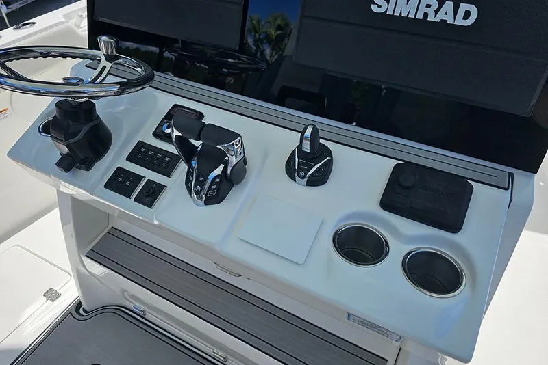 Slide: The Image of 2026 Sea Pro 322 Offshore boat console with steering wheel and controls. - 31