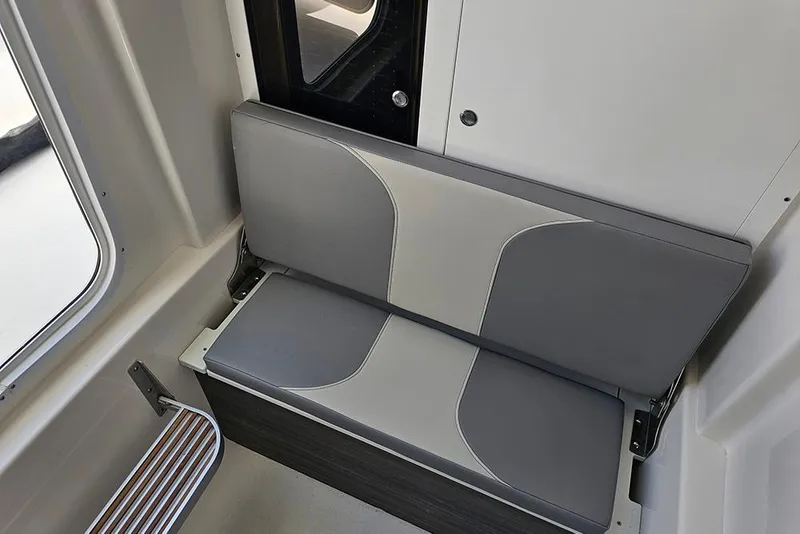 Slide: The Image of 2026 Sea Pro 322 Offshore interior seating with gray and white cushioned design. - 37