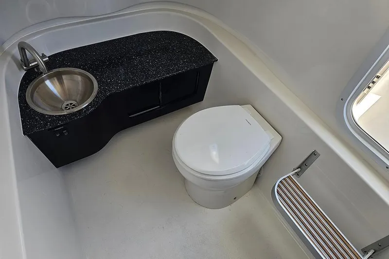 Slide: The Image of 2026 Sea Pro 322 Offshore boat bathroom with sink and toilet. - 39