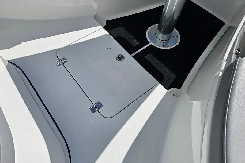 Slide: The Image of 2026 Sea Pro 322 Offshore boat interior with storage compartment and seating area. - 45