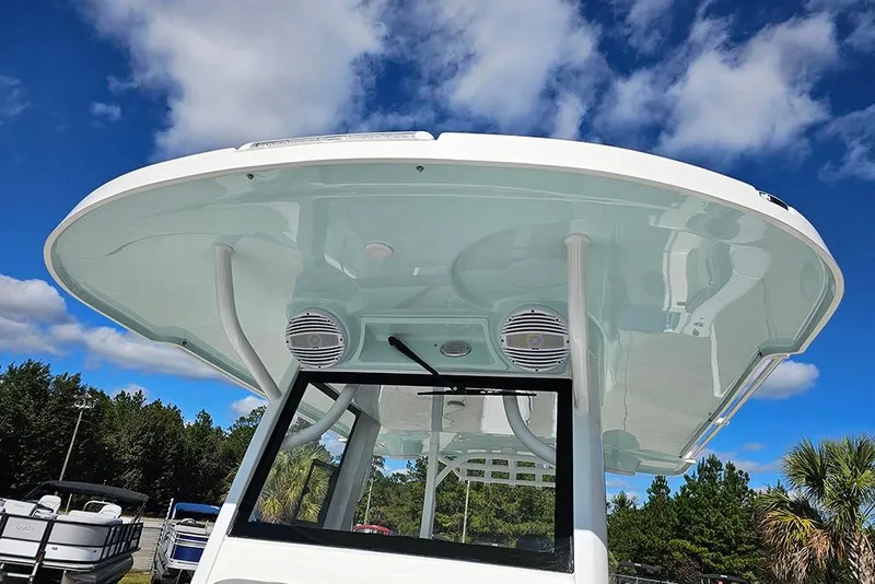 Slide: The Image of 2026 Sea Pro 322 Offshore boat canopy against a clear blue sky. - 55