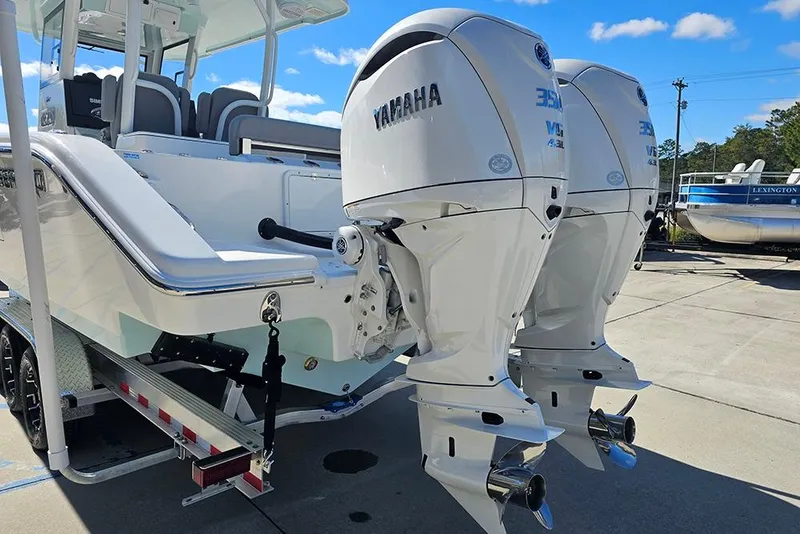 Slide: The Image of 2026 Sea Pro 322 Offshore boat with dual Yamaha outboard engines on a trailer. - 8