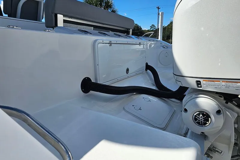 Slide: The Image of 2026 Sea Pro 322 Offshore boat interior with engine and seating area. - 9