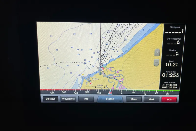 Slide: The Image of Navigation display on a 2003 Sea Ray 340 Sundancer showing depth and GPS coordinates. - 10