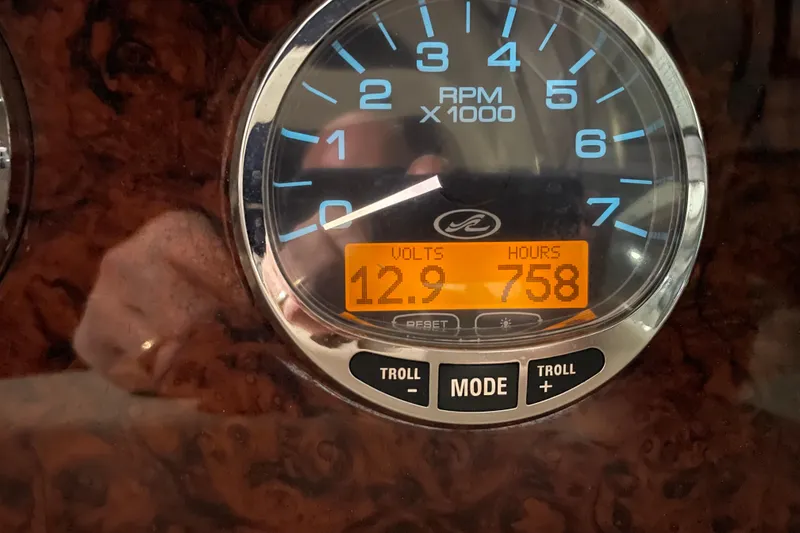 Slide: The Image of Gauge display of 2003 Sea Ray 340 Sundancer showing 12.9 volts and 758 hours. - 12