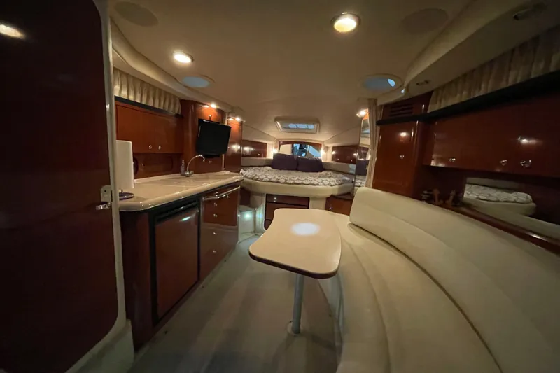 Slide: The Image of Luxurious interior of a 2003 Sea Ray 340 Sundancer yacht with elegant seating and modern amenities. - 18