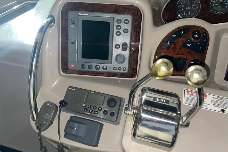 Slide: The Image of Control panel of 2003 Sea Ray 340 Sundancer with navigation and communication equipment. - 8