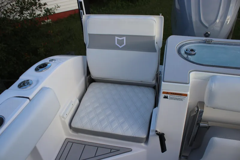 Slide: The Image of 2026 Sea Fox 328 Commander boat seat with diamond-pattern upholstery and integrated cup holders. - 10