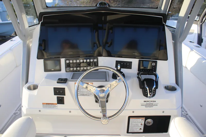 Slide: The Image of 2026 Sea Fox 328 Commander helm with dual screens and modern controls. - 15