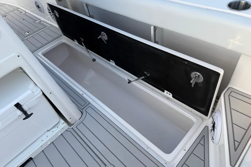 Slide: The Image of 2026 Sea Fox 328 Commander boat storage compartment with open lid, showcasing spacious interior. - 22