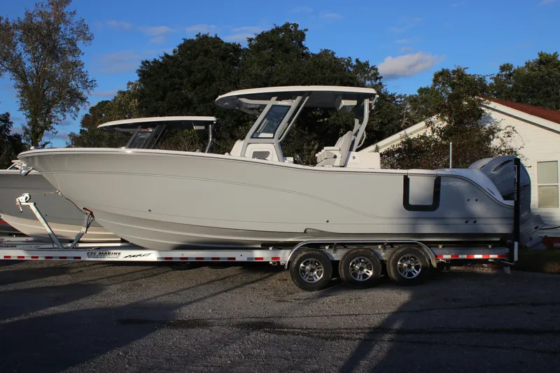 Slide: The Image of 2026 Sea Fox 328 Commander boat on trailer, parked outdoors. - 30
